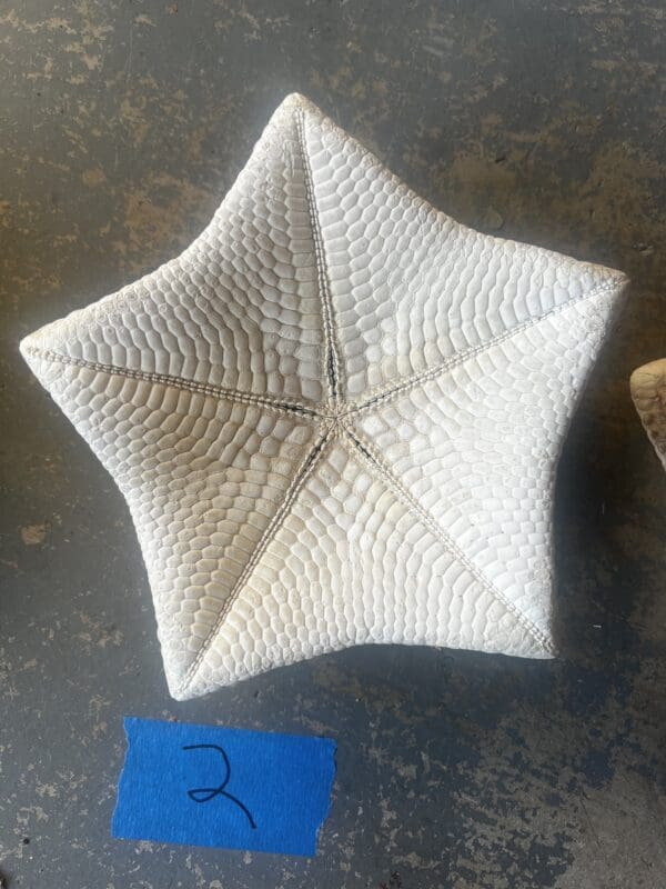 A white star shaped object sitting on top of a table.