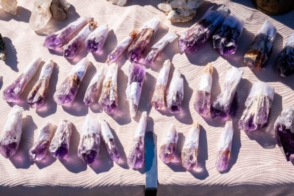 Baby Amethyst Dragon's Teeth Scepters-Bahia crystals on display at a market.